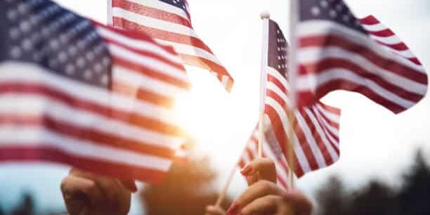 Group of people celebrating with national US flag